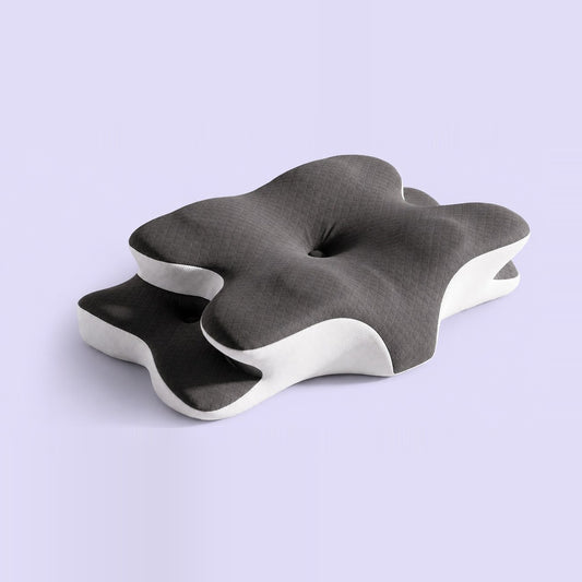 Numa Pillow contoured cervical memory foam pillow on a lilac background